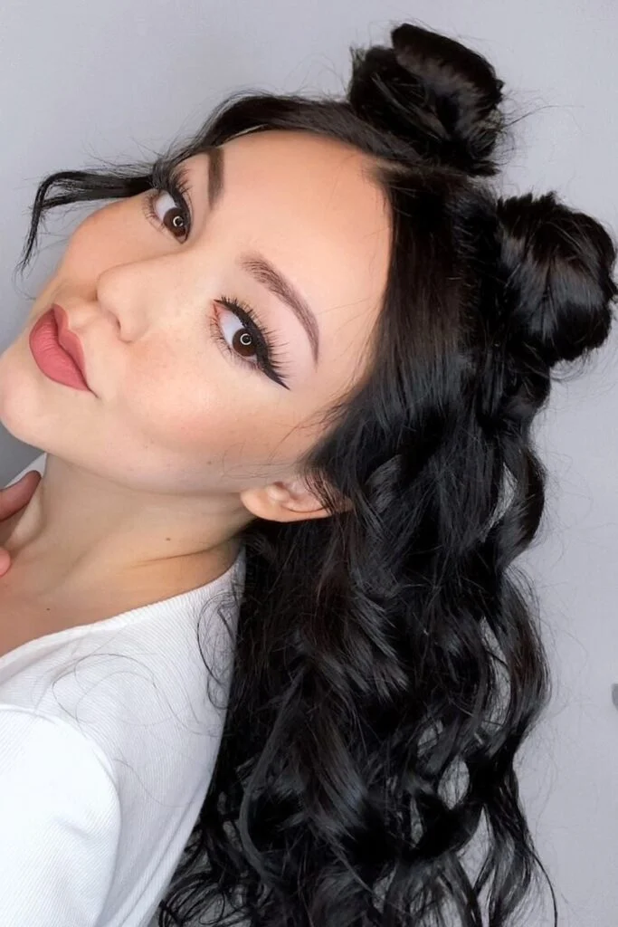 Sleek Space Buns with Loose Waves