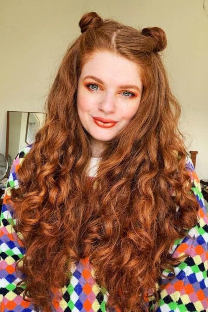 Voluminous Red Curls with Space Buns