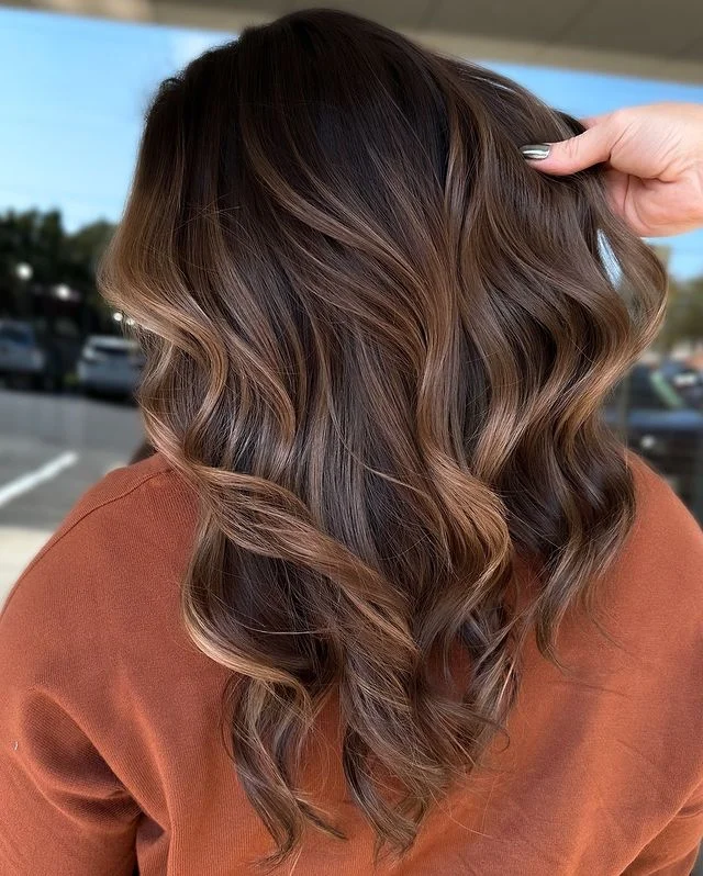 Caramel Balayage Curls with a Warm Finish